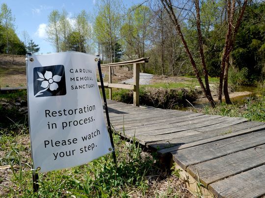 Picture of bridge with a restoration sign in front.