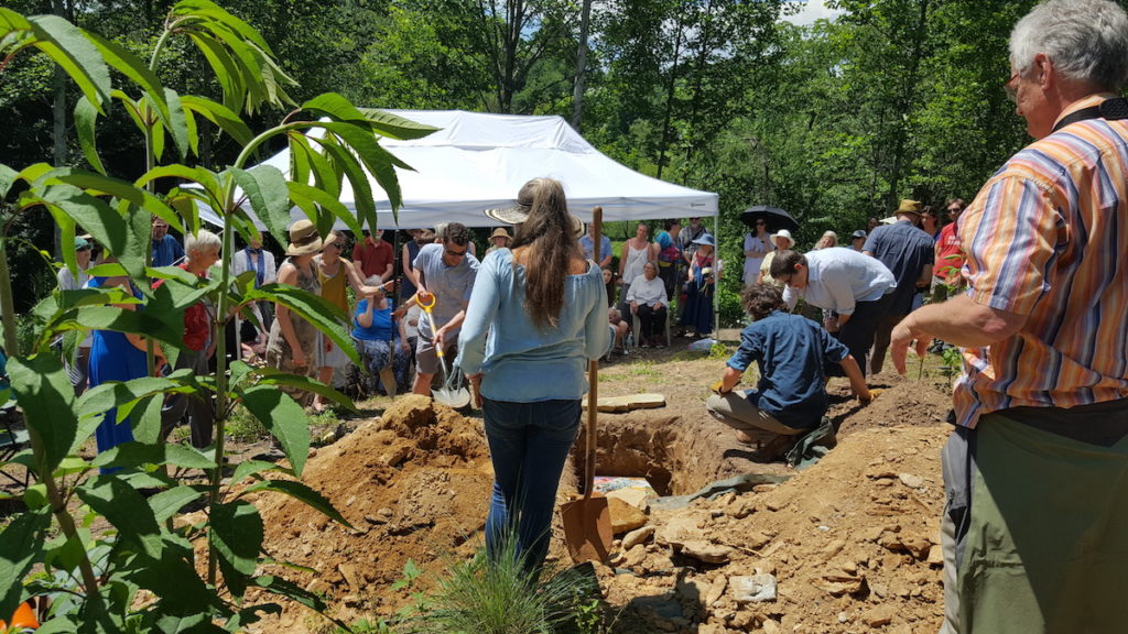 a group of people attending a green burial